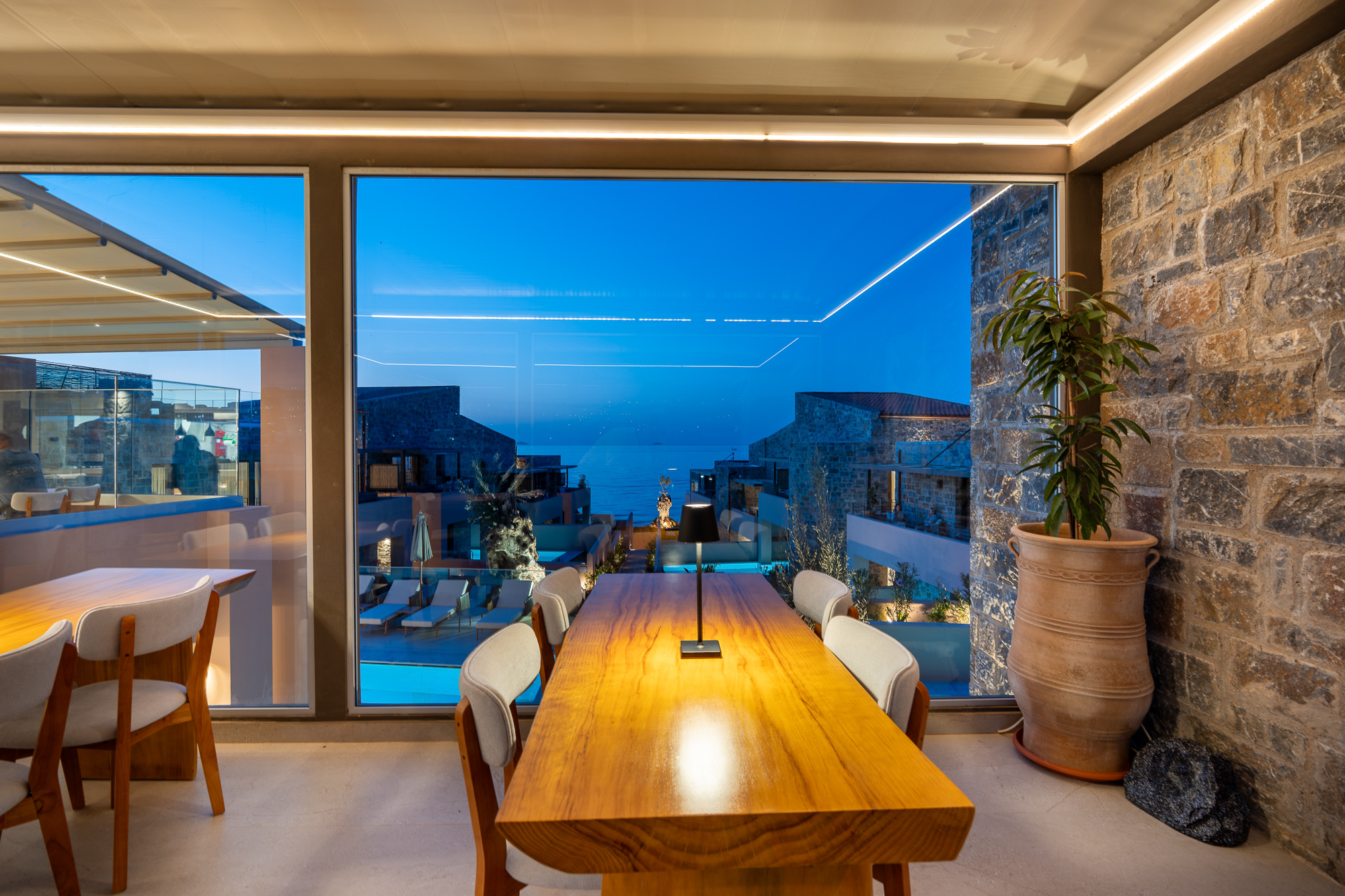 Indoor dining overlooking the pool