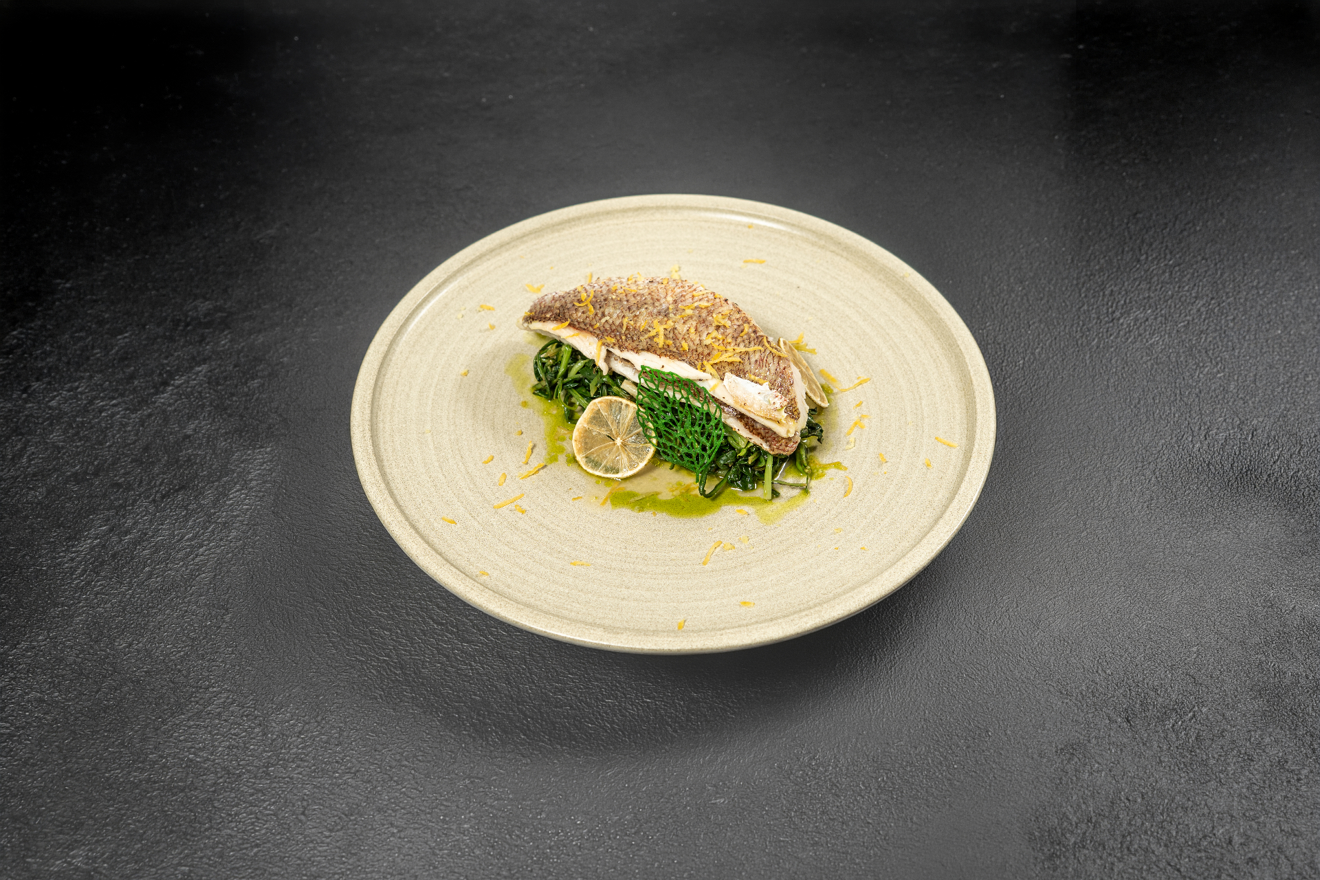 Sea bass fillet with wild greens